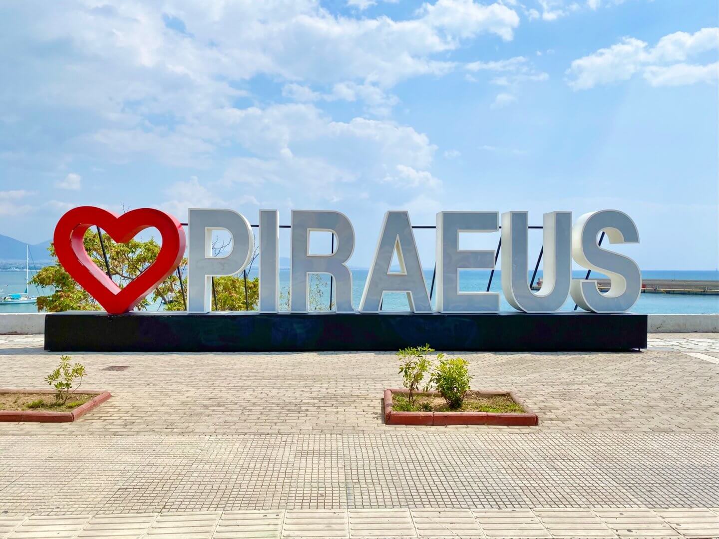 Heart Piraeus sign in front of the sea