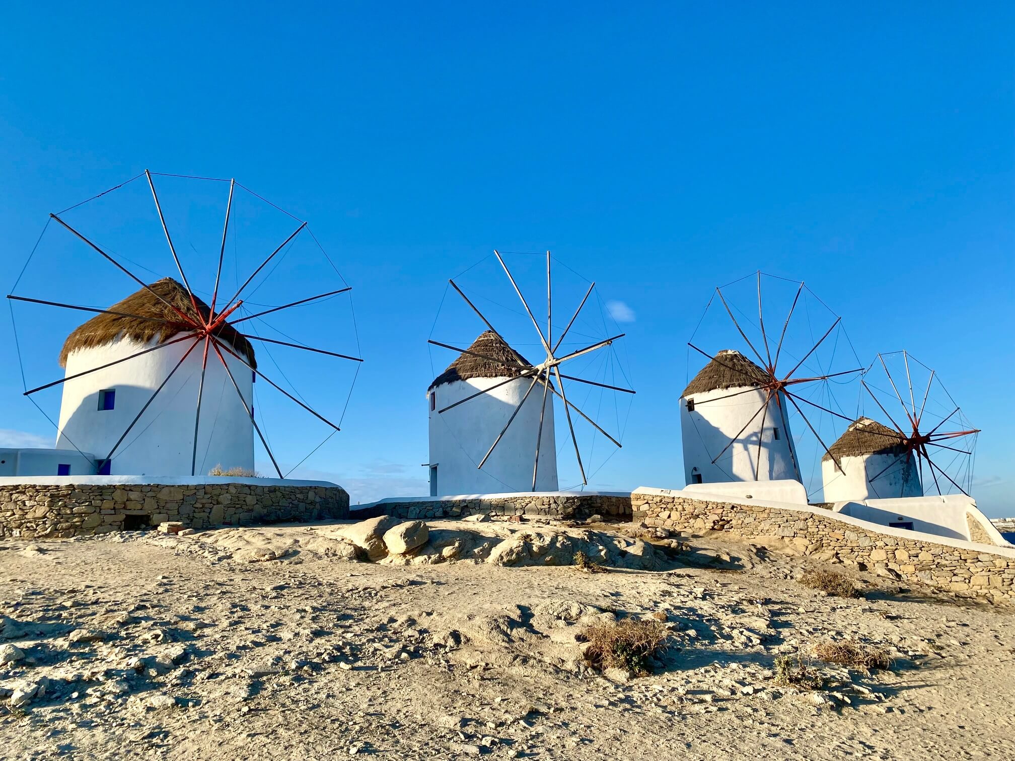 4 iconic white windmills of Mykonos with thatched rooves